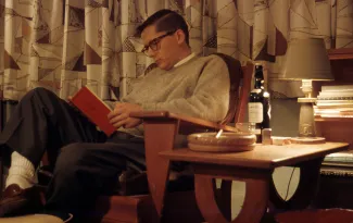 Robert Armacost reading in Beta House, 1958